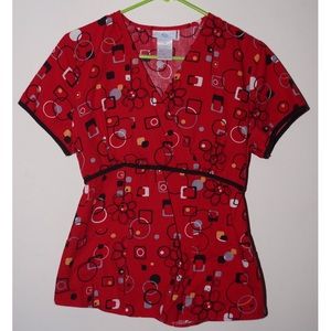 Red geometric floral pattern scrub top